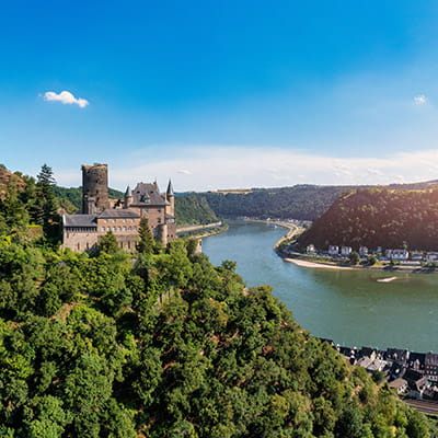 A view down the Rhine river in the summer, overlooked by Katz Castle in Sankt Goarhausen, Germany